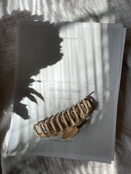 A startup planner with a hair clip in soft lighting, ideal for business and planning themes.