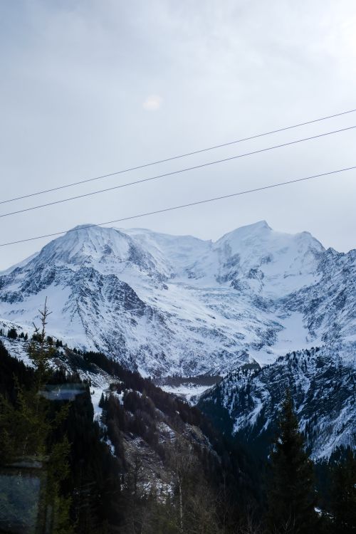 Free A breathtaking winter landscape of snow-covered mountains and valleys. Stock Photo