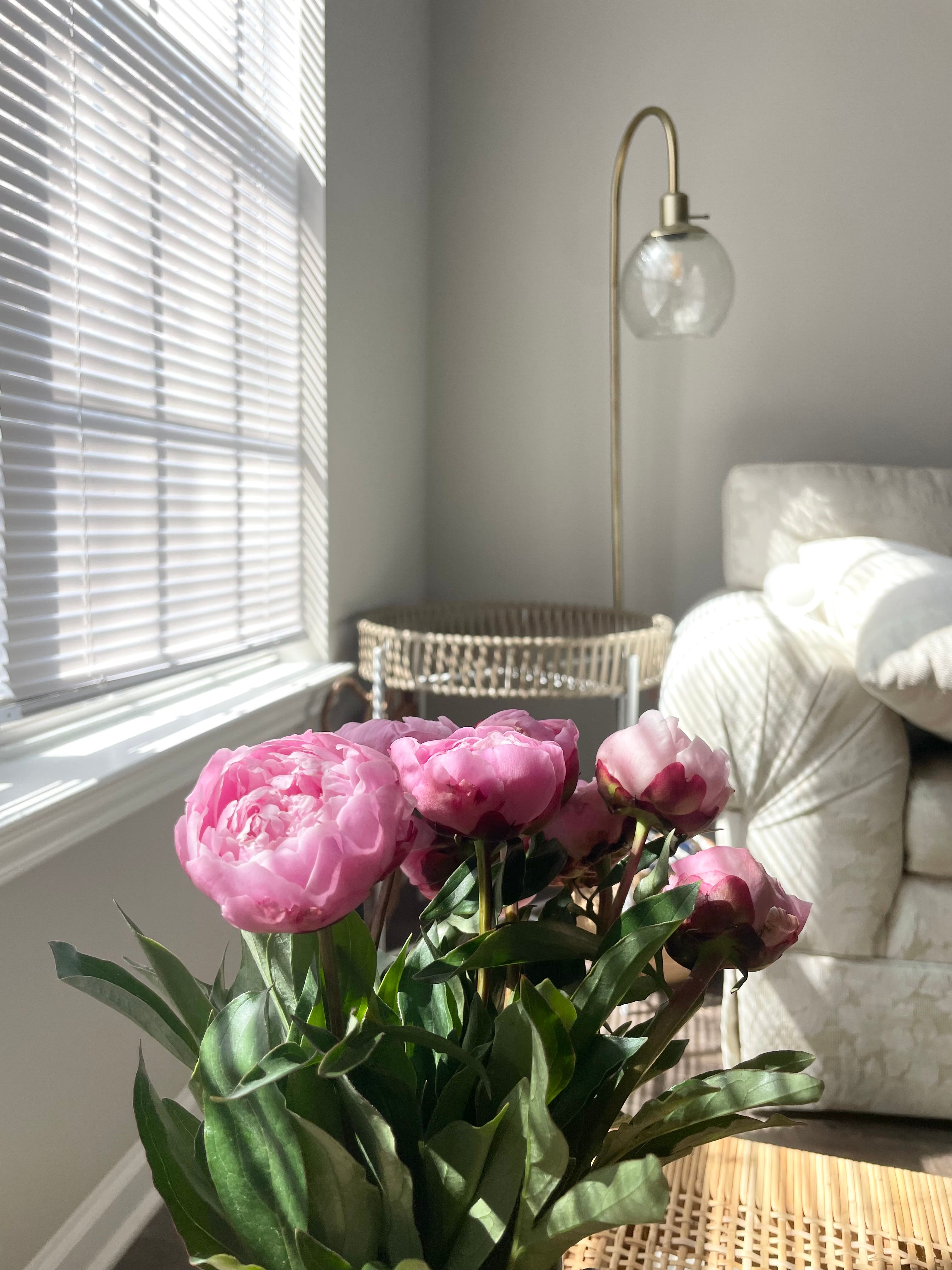 Home Interior with Pink Peonies and a Soft Armchair · Free Stock Photo