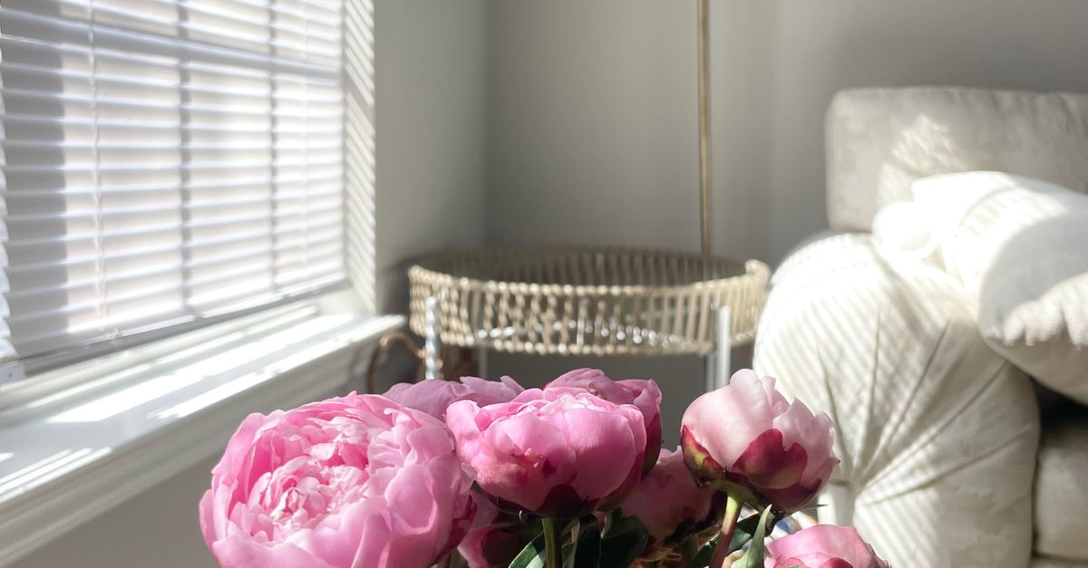 Home Interior with Pink Peonies and a Soft Armchair · Free Stock Photo