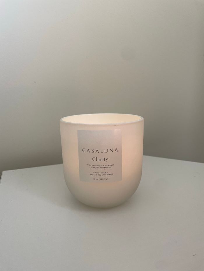 Soft neutral candle labelled Clarity