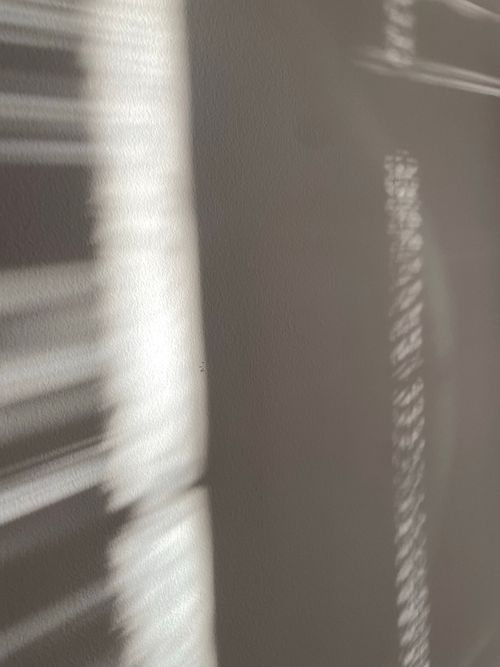 Free Blurred abstract patterns of light and shadow creating a textured effect. Stock Photo