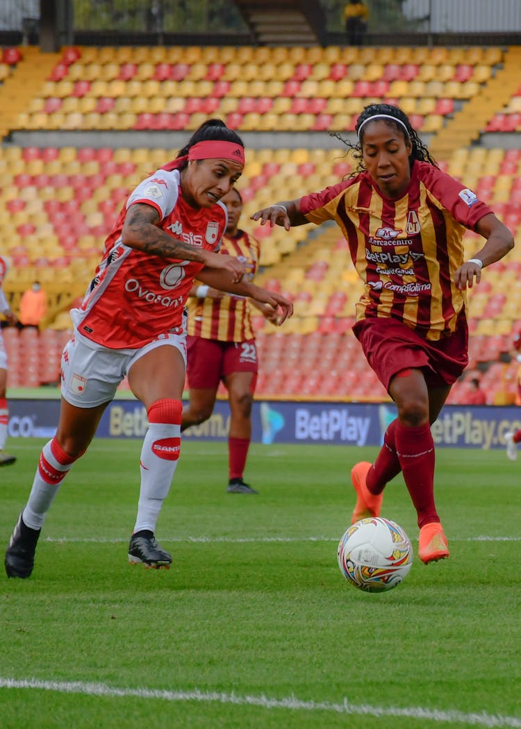 Women Playing Football Game