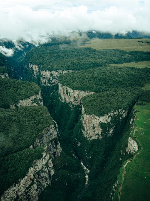 Free Dramatic aerial view of canyons with lush vegetation in Cambará do Sul, Brazil, showcasing stunning natural formations. Stock Photo