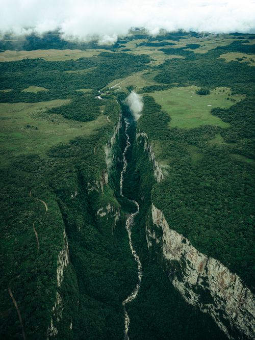Free Stunning aerial view of Itaimbezinho Canyon, showcasing lush greenery and deep gorges. Stock Photo