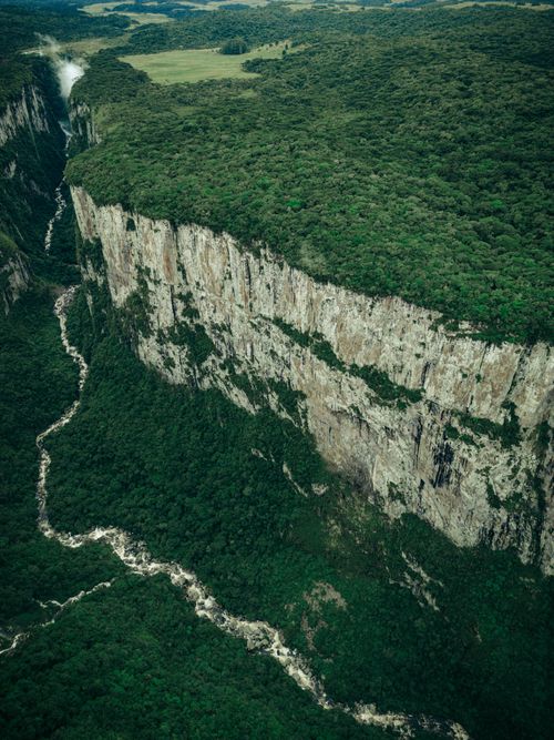 Free Stunning aerial shot of Itaimbezinho Canyon in Cambará do Sul, Brazil, showcasing dramatic cliffs and lush greenery. Stock Photo