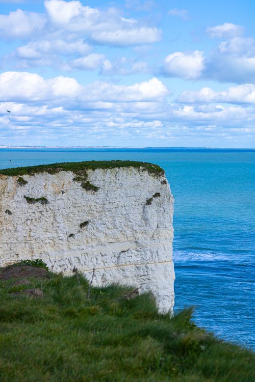 Free Stunning view of the white cliffs over the blue sea at Bournemouth, England, perfect for travel enthusiasts. Stock Photo