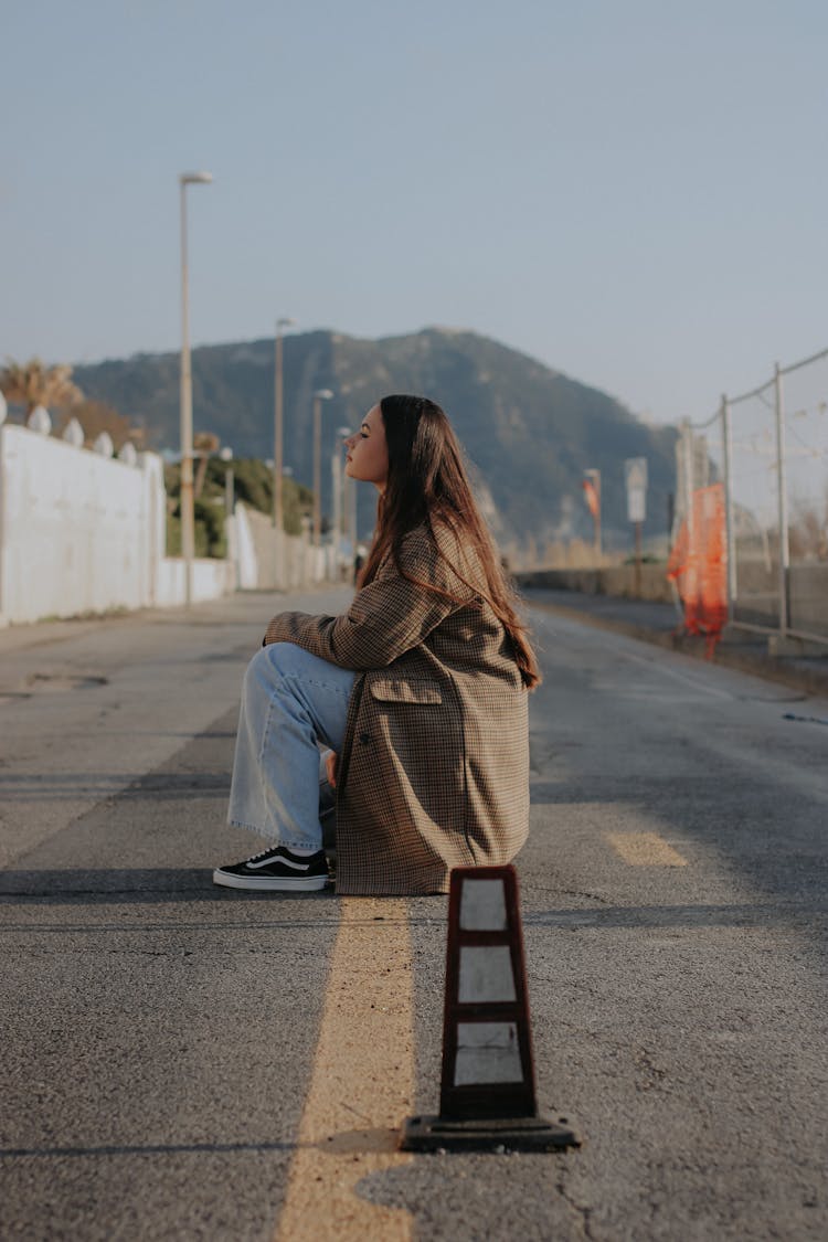 Model On Road In Checkered Coat