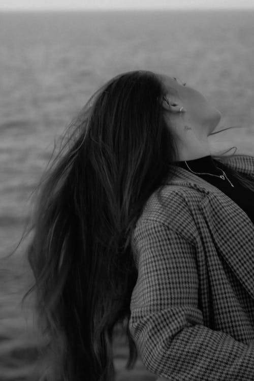 A Portrait of a Young Woman in Motion in Black and White