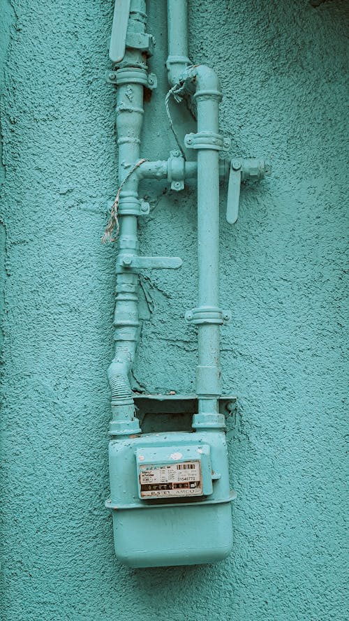 Pipes and Gas Meter Painted in the Color of the House