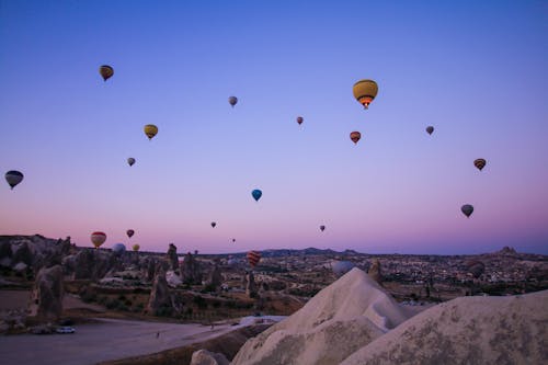 Hot Air Balloons Flying over Cappadocia at Sunset 