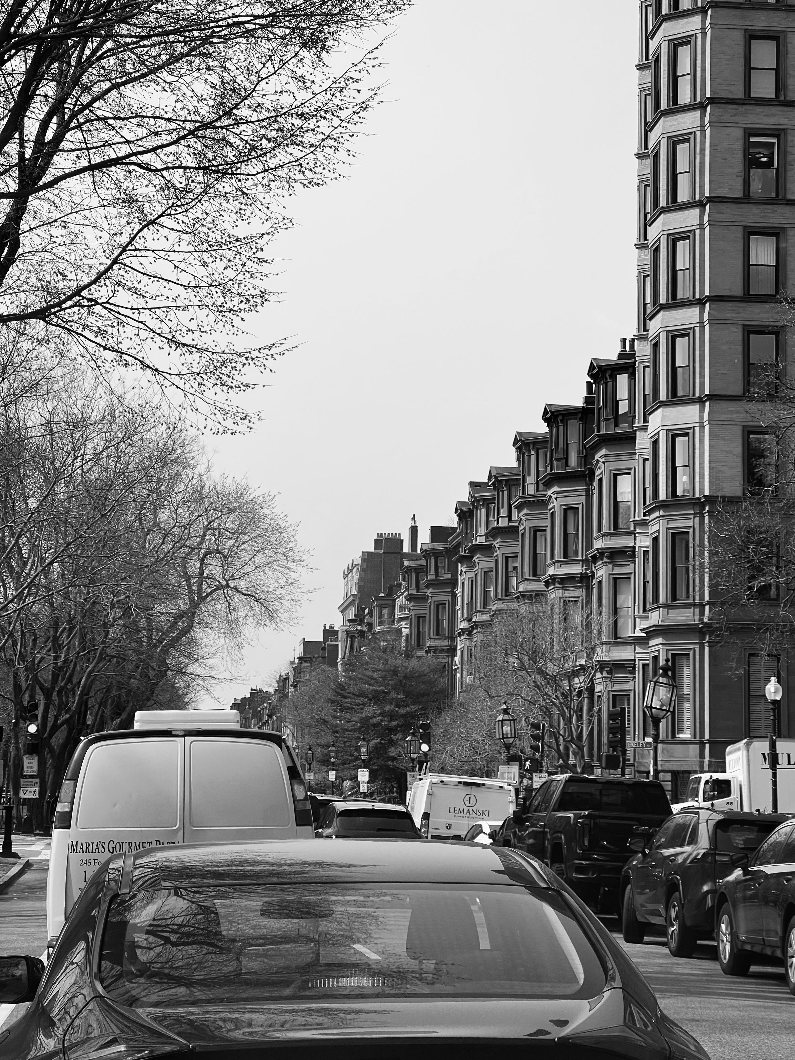 Black and White Picture of a City Street with Cars Parked on the Sides ...