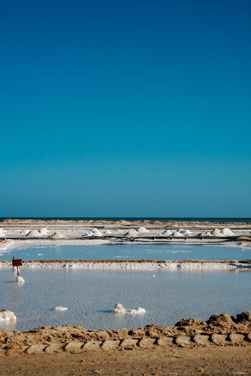 Foto profissional grátis de aldeia, aldeias, areia