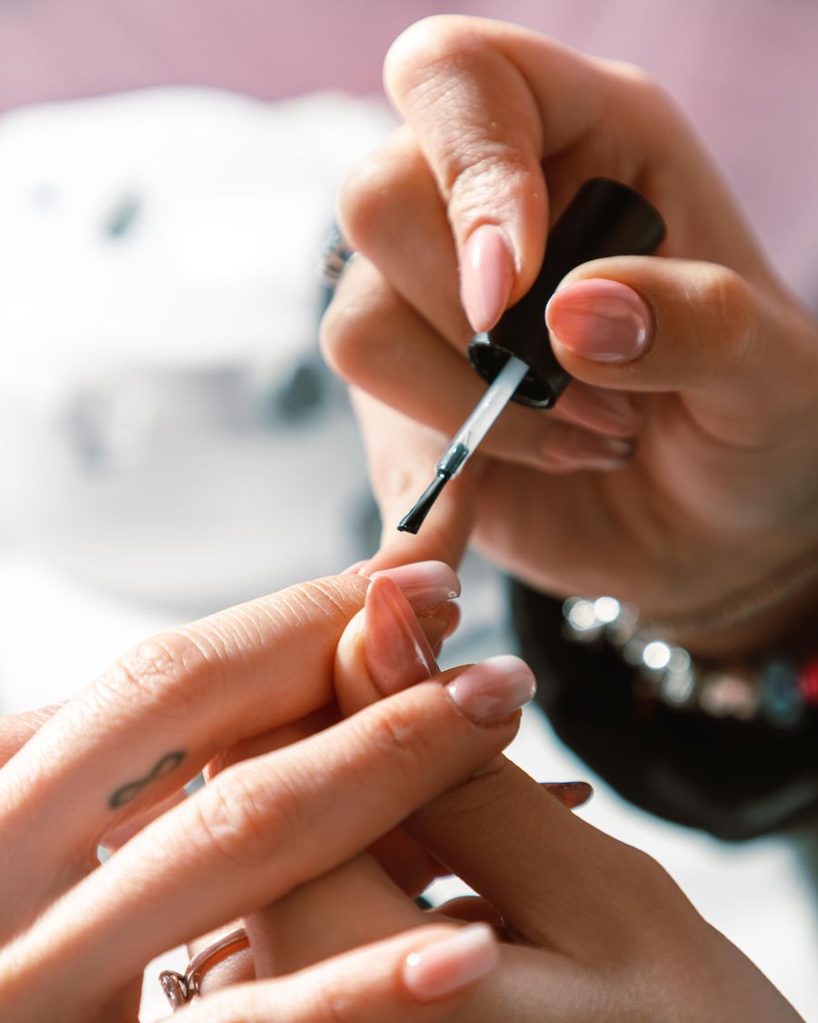 Colour being brushed along the nail plate