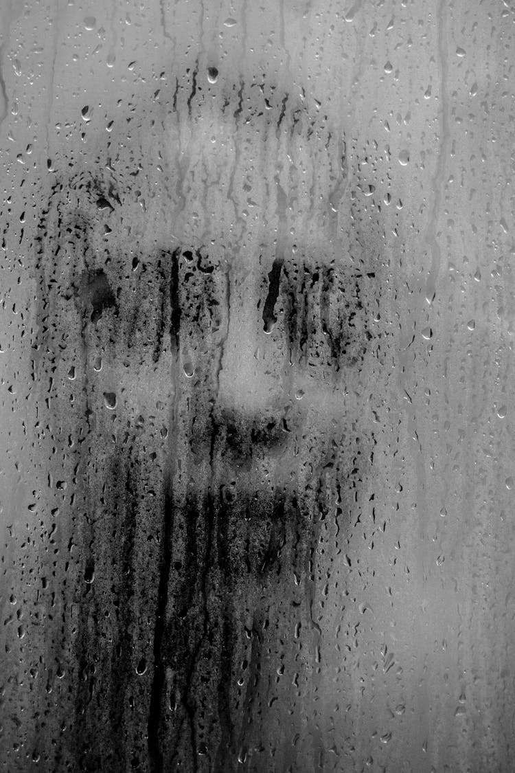 Woman Face Behind Shower Glass