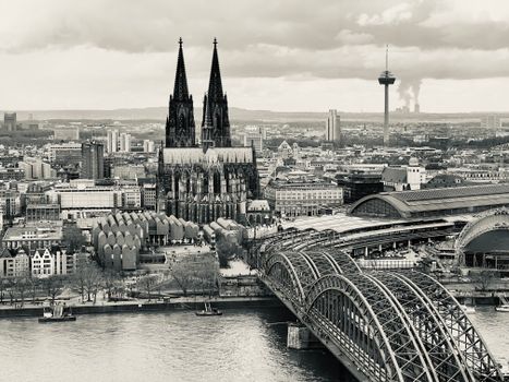 Stunning aerial view of Cologne Cathedral by the Rhine in Germany, showcasing iconic architecture.