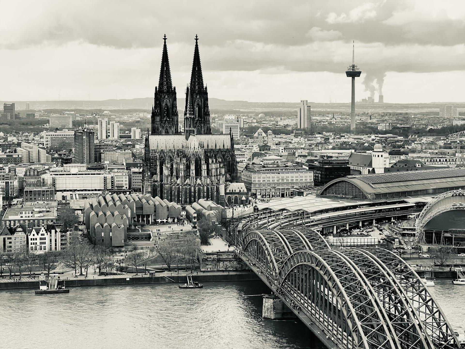 Stunning aerial view of Cologne Cathedral by the Rhine in Germany, showcasing iconic architecture.