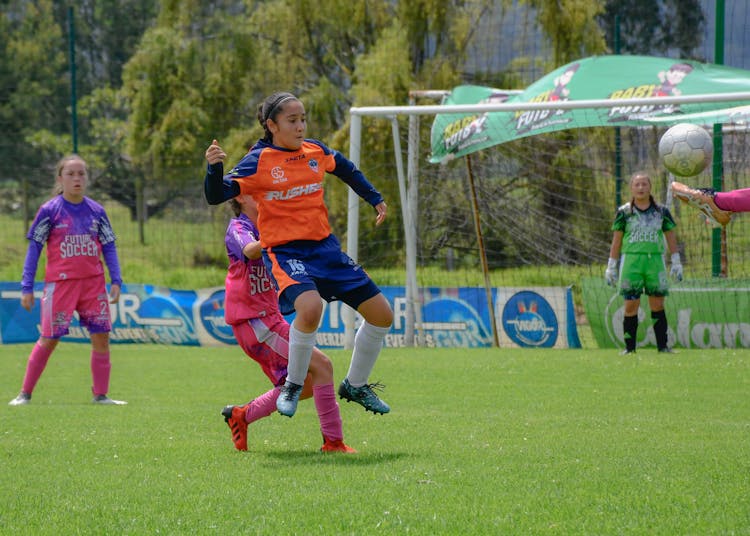 Women Playing Football Match