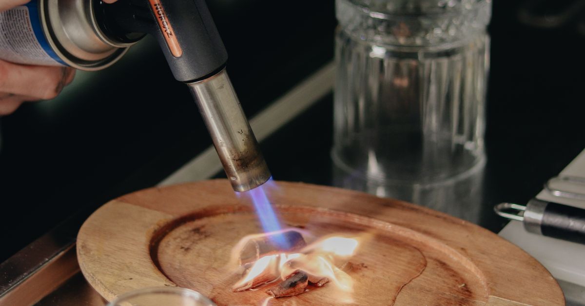 Using A Blowtorch Bartender Using Blowtorch · Free Stock Photo