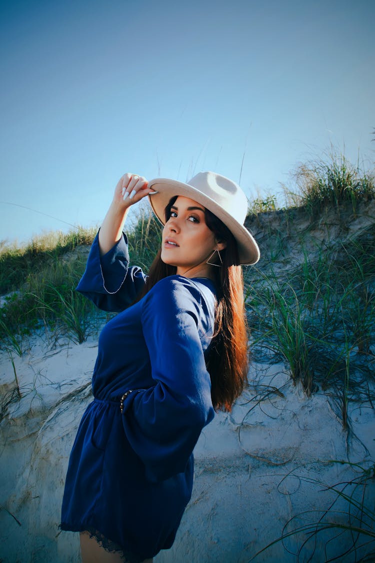 Model In Hat On Beach