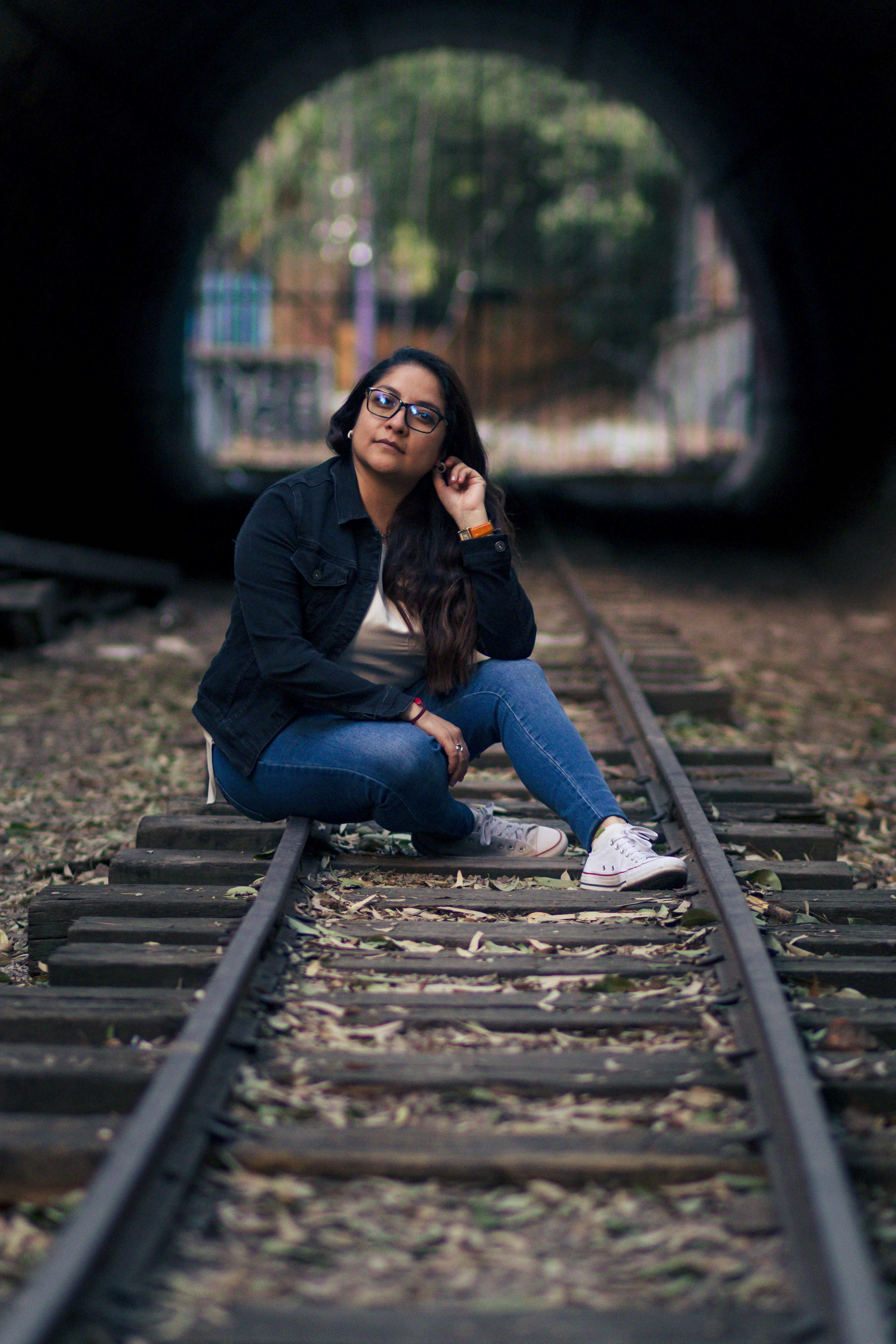 woman, blue, long-sleeved, top, jeans, train railings, girl, pose,  squatting, young | Pxfuel
