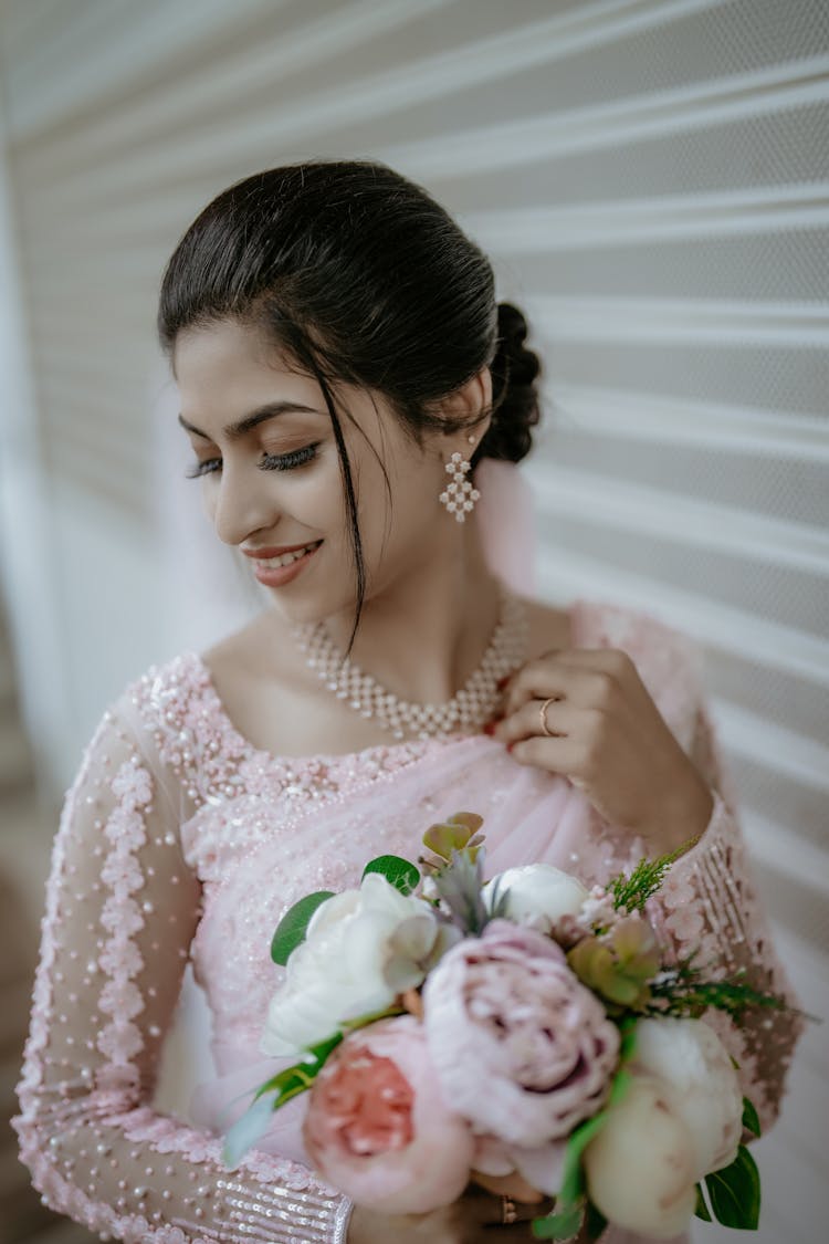 Beautiful Woman In Wedding Dress With Bouquet