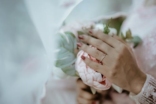 Bride Hand on Flowers