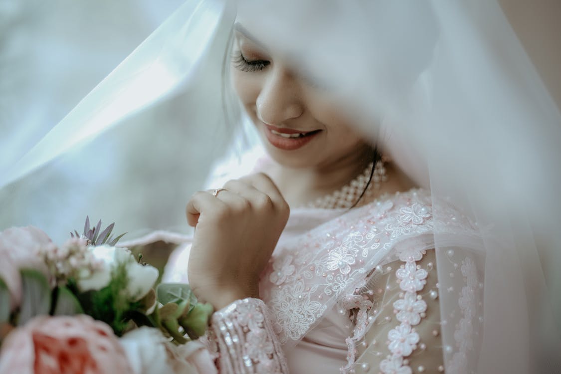 Premium Photo  Happy girl bride with bridal veil having fun