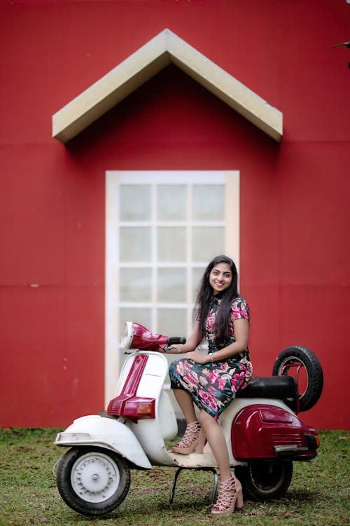 Woman Posing on Scooter