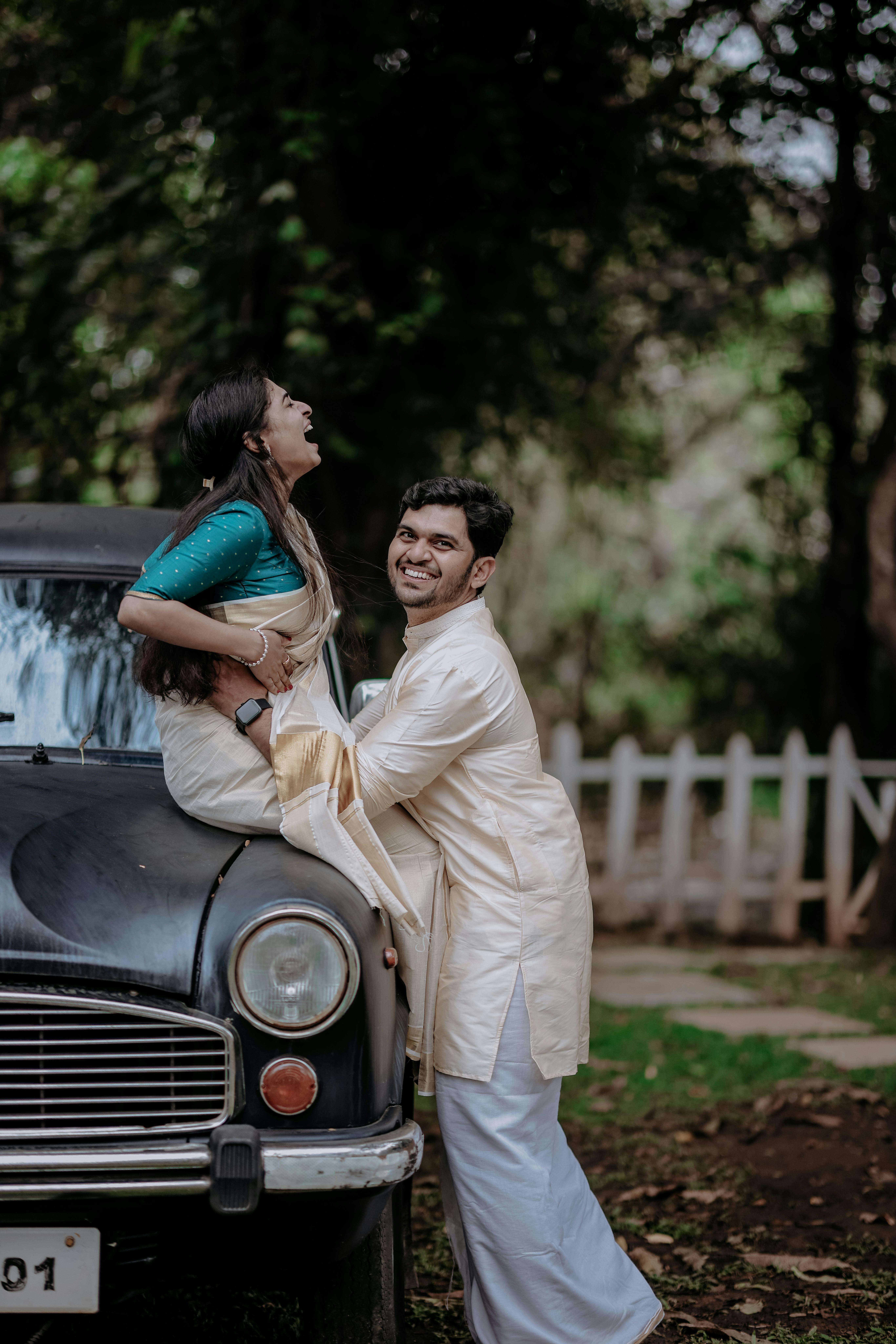 Mesmerizing indian couple posing in front of their car transportation |  Photo 257226