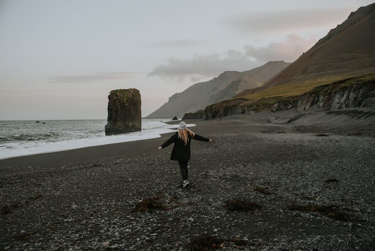 Woman On Fauskasandur Beach In Iceland