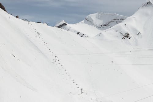 Ski Lift on Slope in Mountains