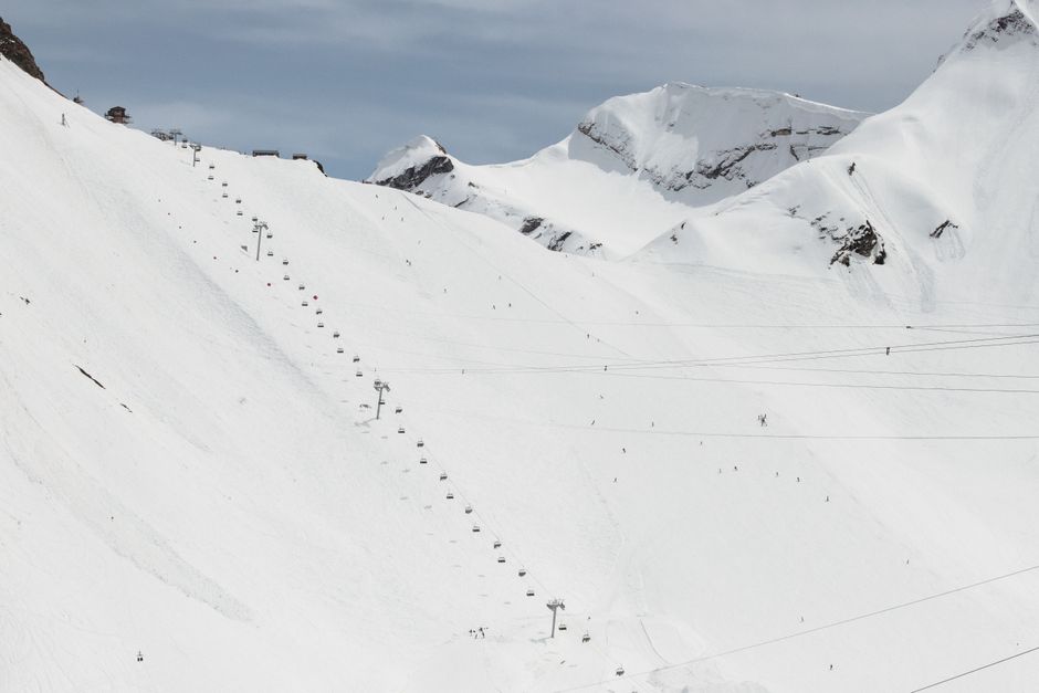 Snow-covered mountains with a ski lift in Krasnaya Polana, Russia, ideal for winter sports.