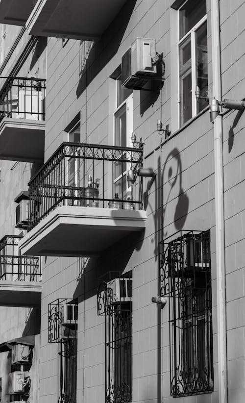 Balconies and Windows on the Facade of a Traditional Residential Building in City 