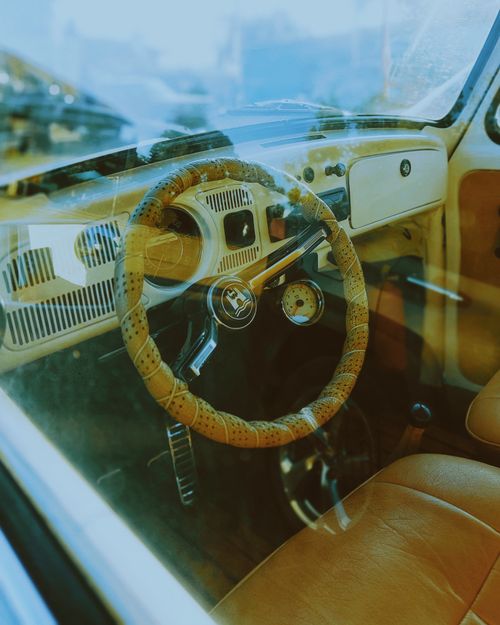 Free Retro car interior showcasing vintage style with leather seating and classic steering wheel. Stock Photo