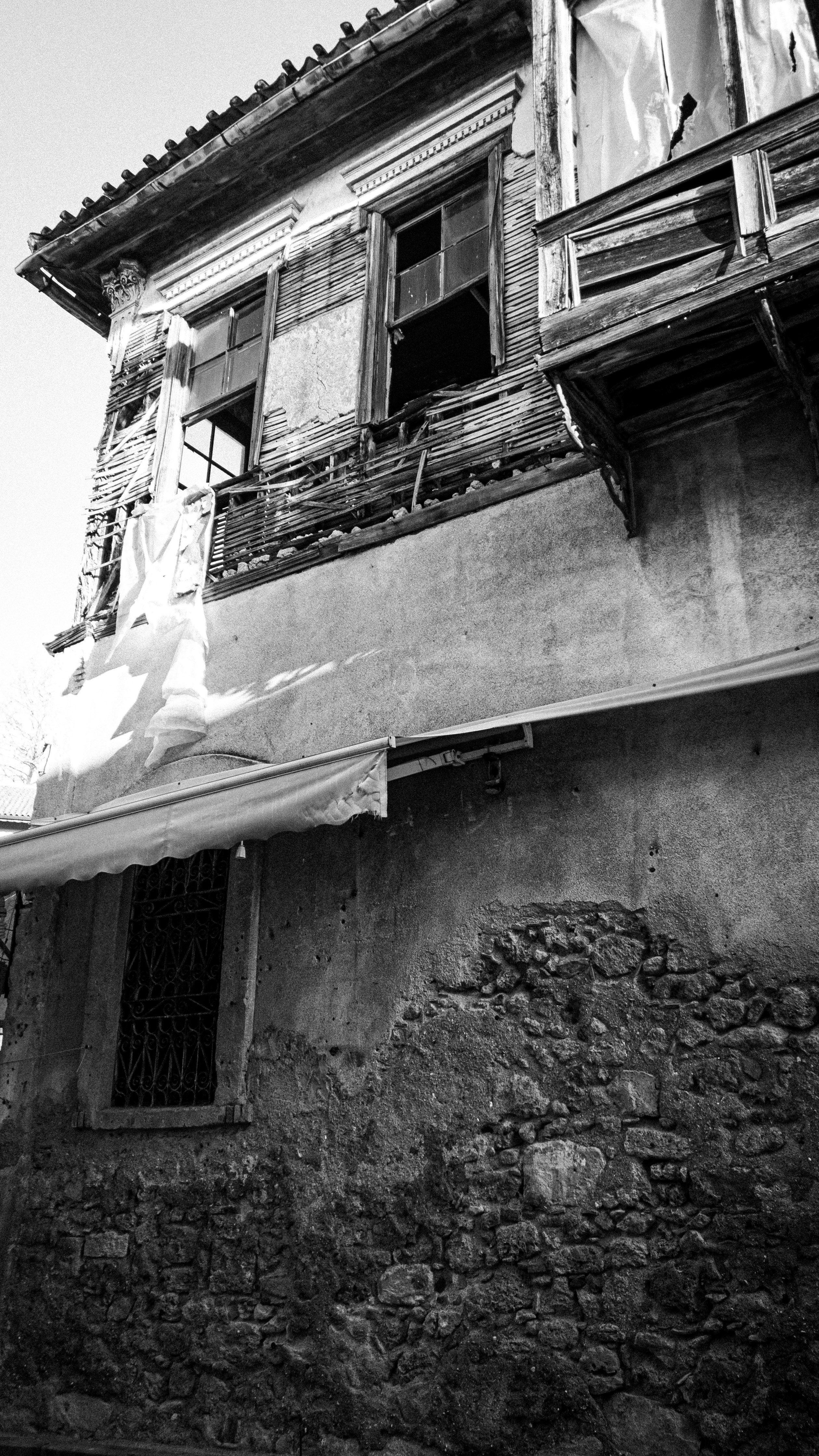 Damaged Timber Facade of Multistory Building · Free Stock Photo