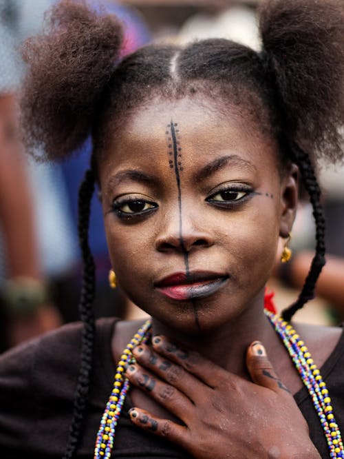 Young Woman with Tribal Tattoo on Face