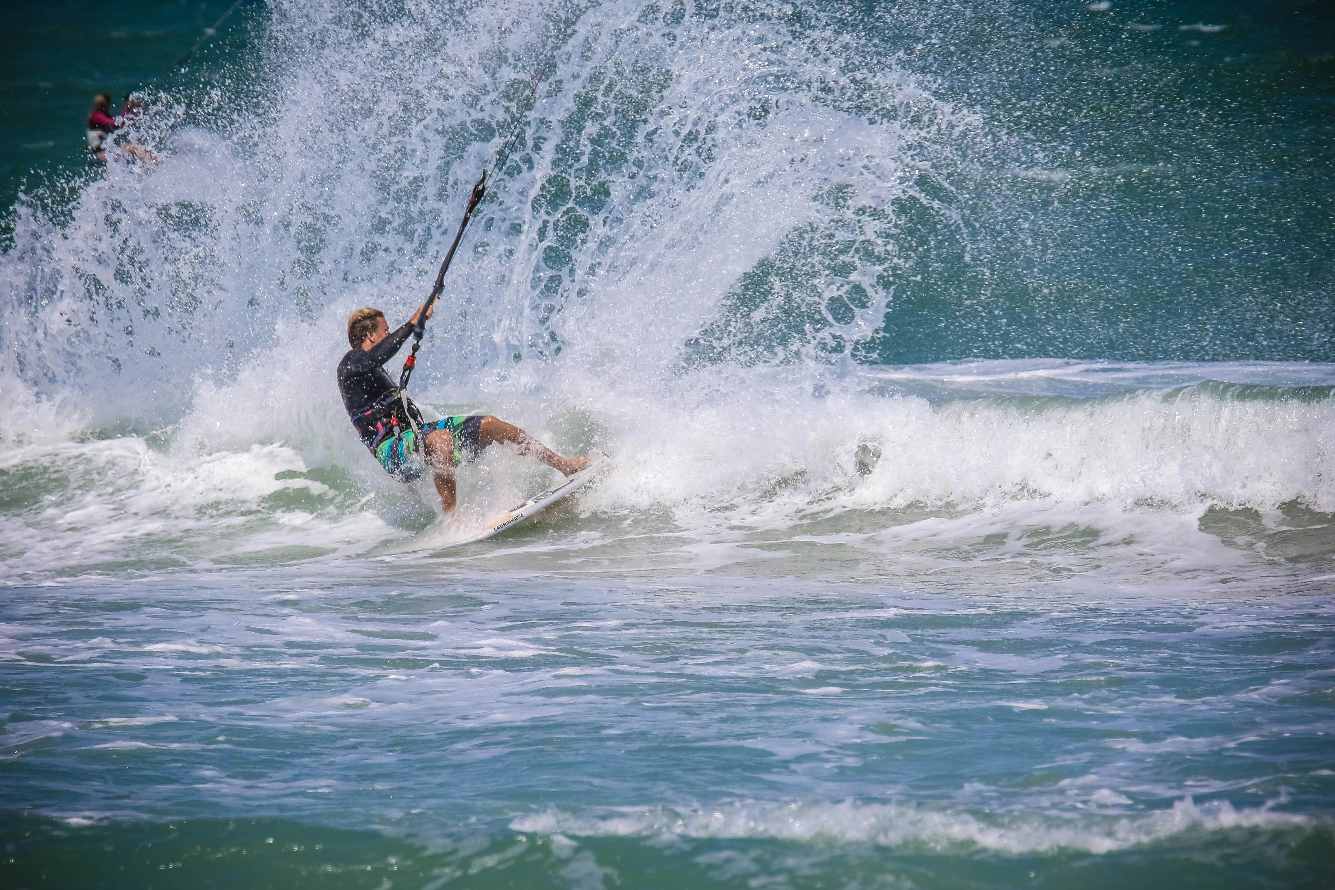 man surfing on sea