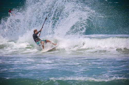 Man Surfing on Sea