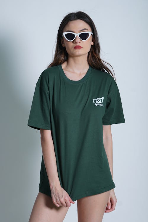 Woman Posing in Sunglasses and Green T-Shirt