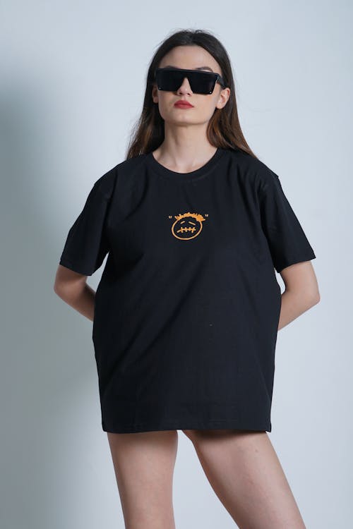 Standing Woman Posing with T-Shirt and Sunglasses