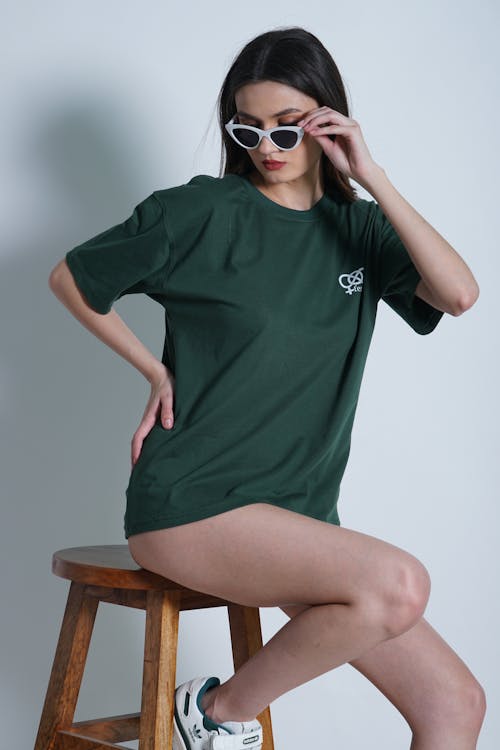 Woman in T-shirt Posing on Chair