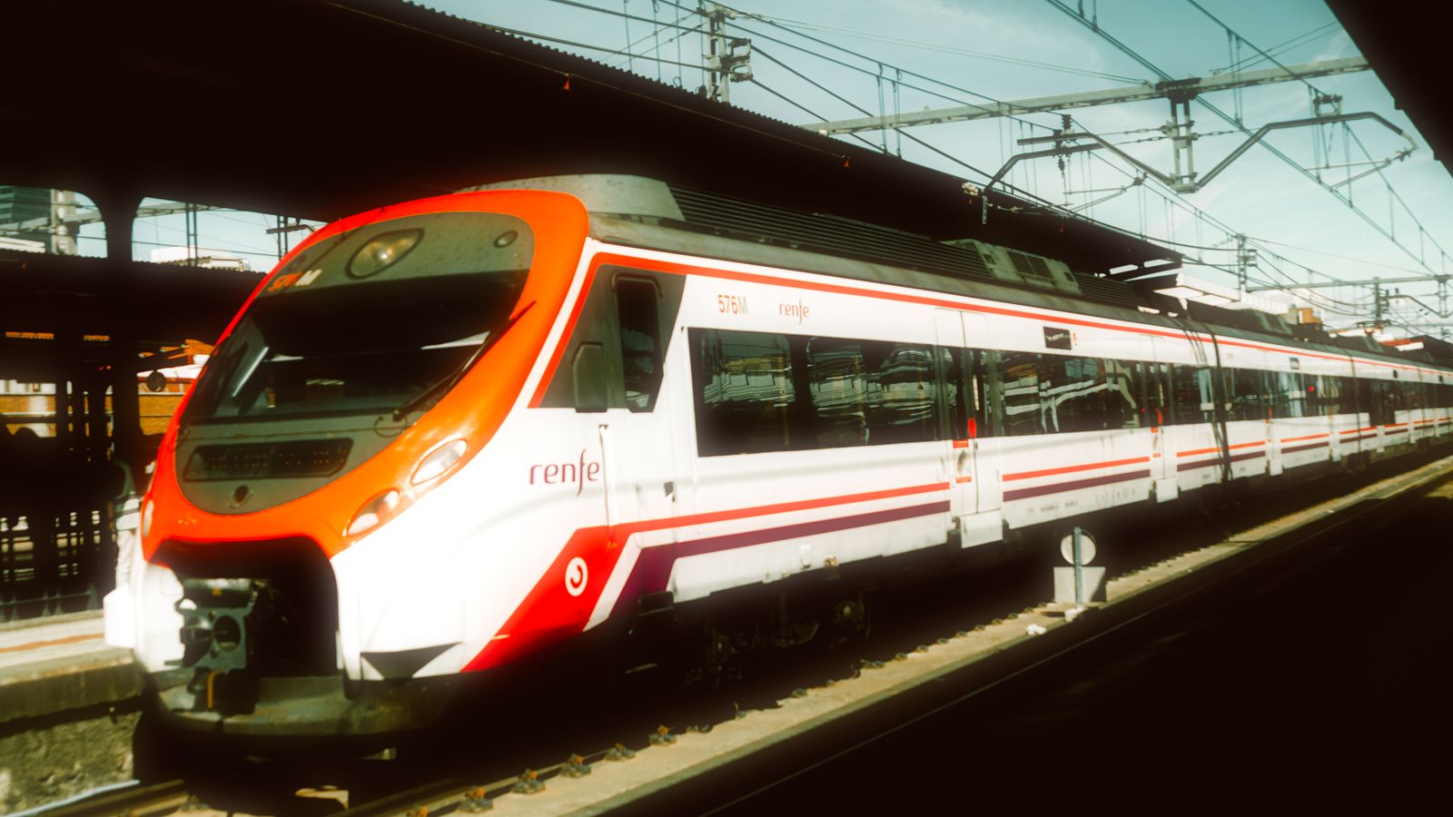 Representative licensed photograph of a passenger train at a Madrid station before October 2026; not the Spain train collision or its damaged trains