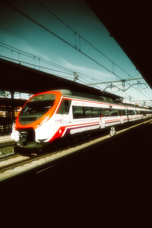 Free A sleek modern train at a railway station in Madrid, Spain, captured during the day. Stock Photo