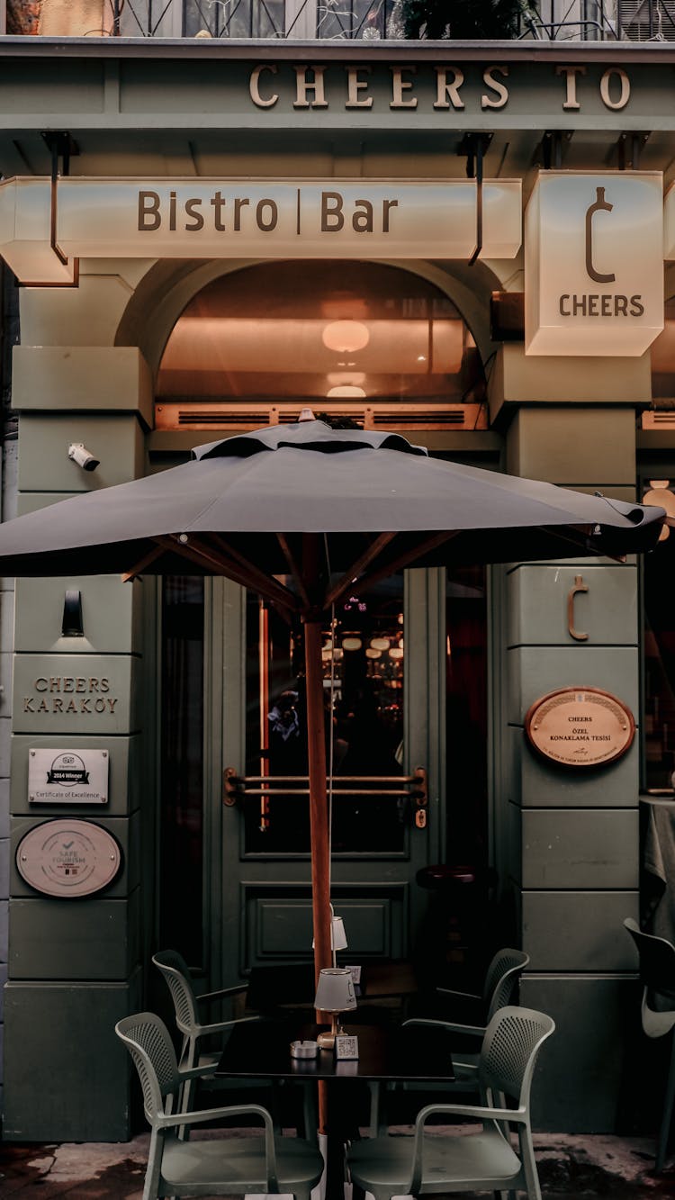 Umbrella Over Chairs Near Bar