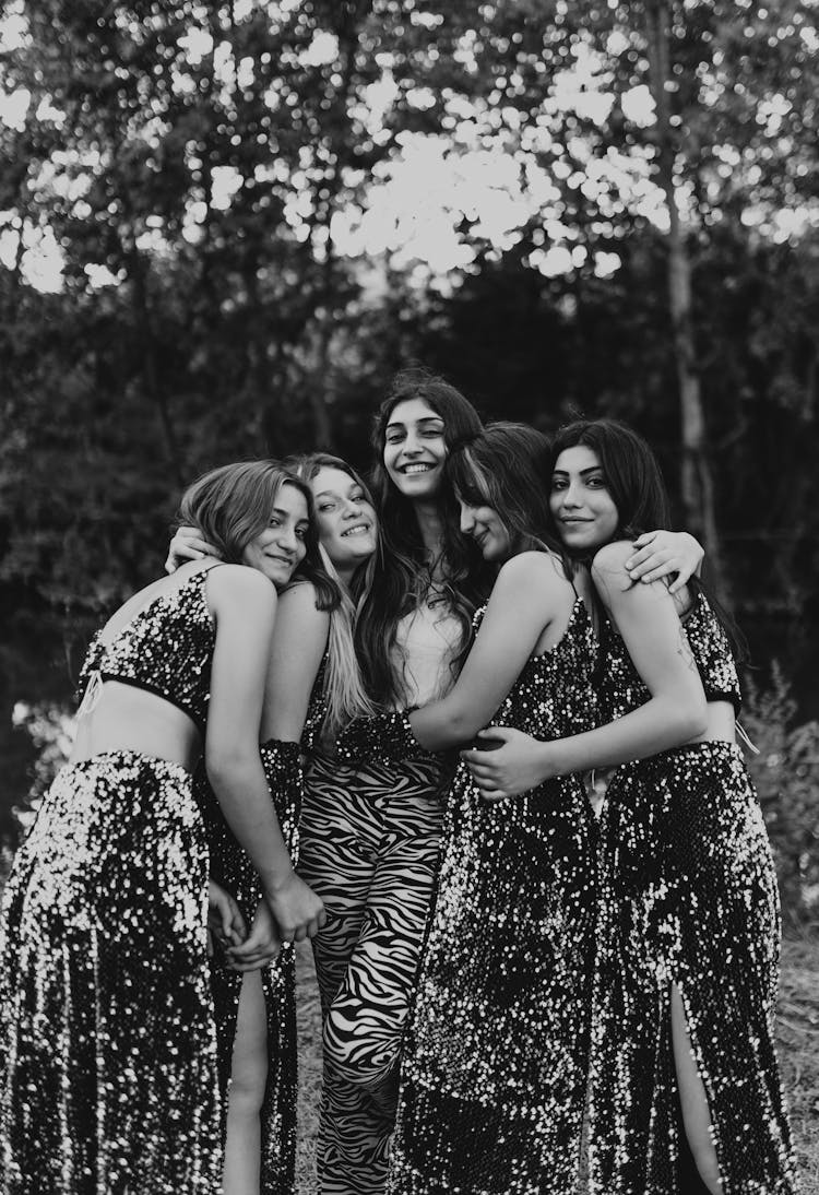 Group Of Five Women Hugging Each Other