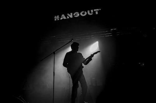 Silhouette of a Guitarist on the Stage at a Concert 
