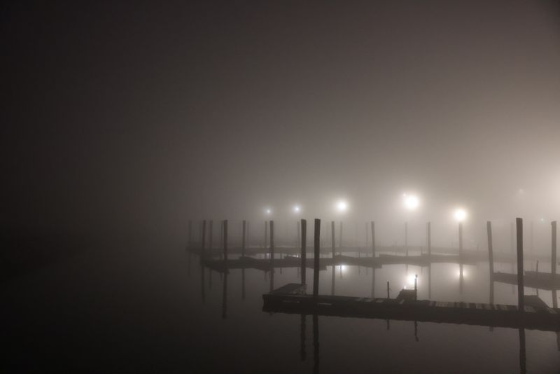 Ash Harbour Teaser cover still: fog over a lit marina dock — David Kanigan on Pexels