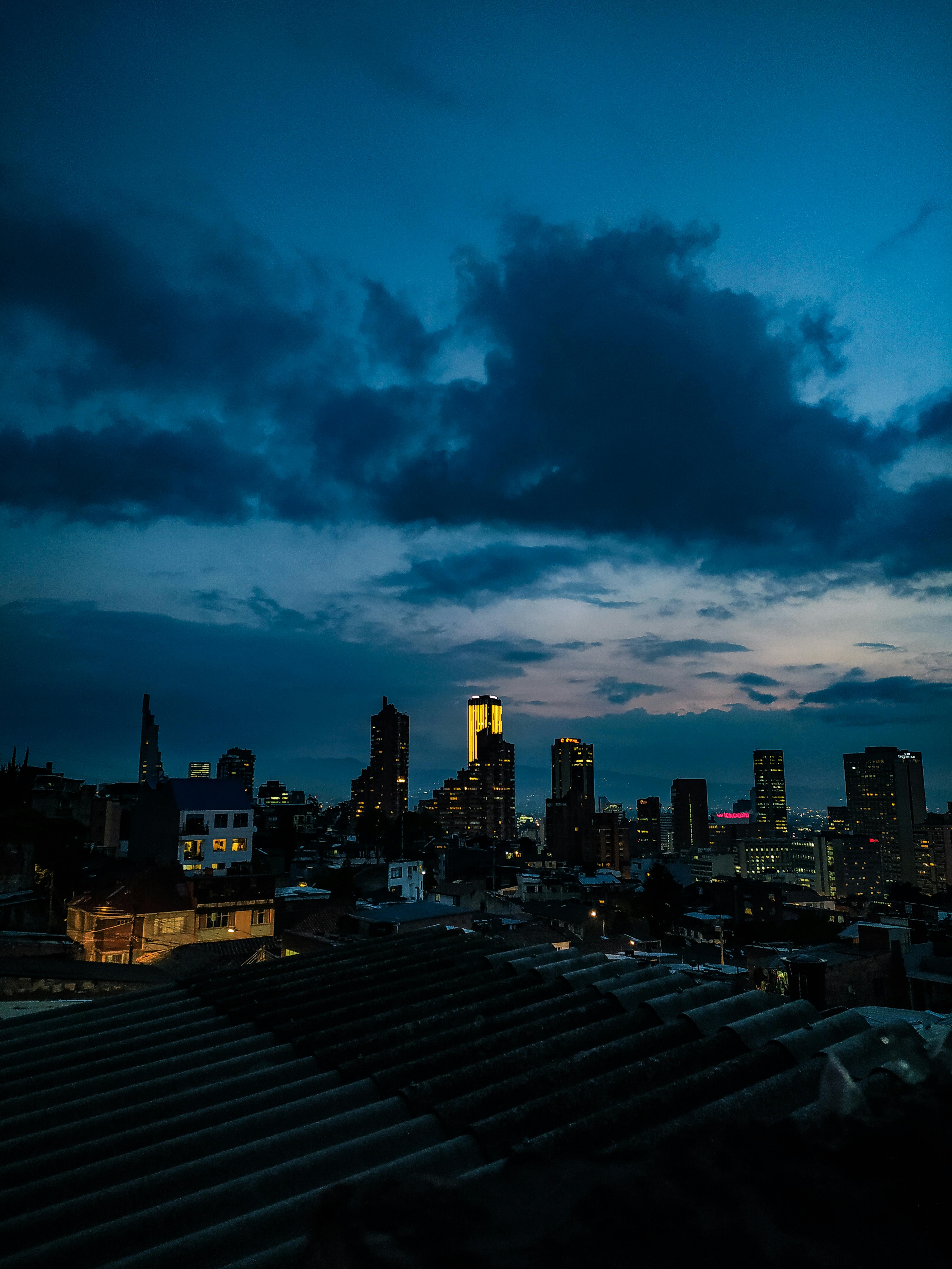 Skyscrapers under Night Sky seen from Roof of Build · Free Stock Photo