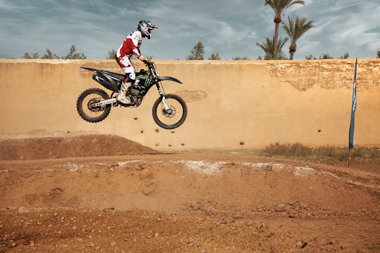 Man Jumping During Motorcycle Competition